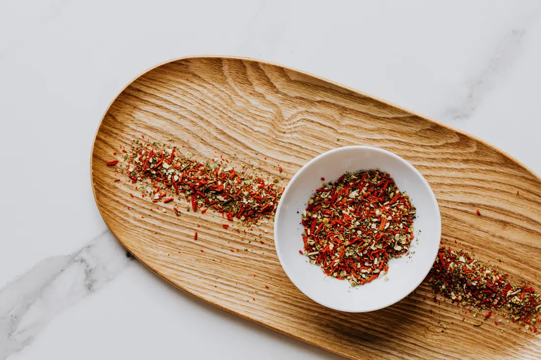 A dry seasoning blend in a small bowl
