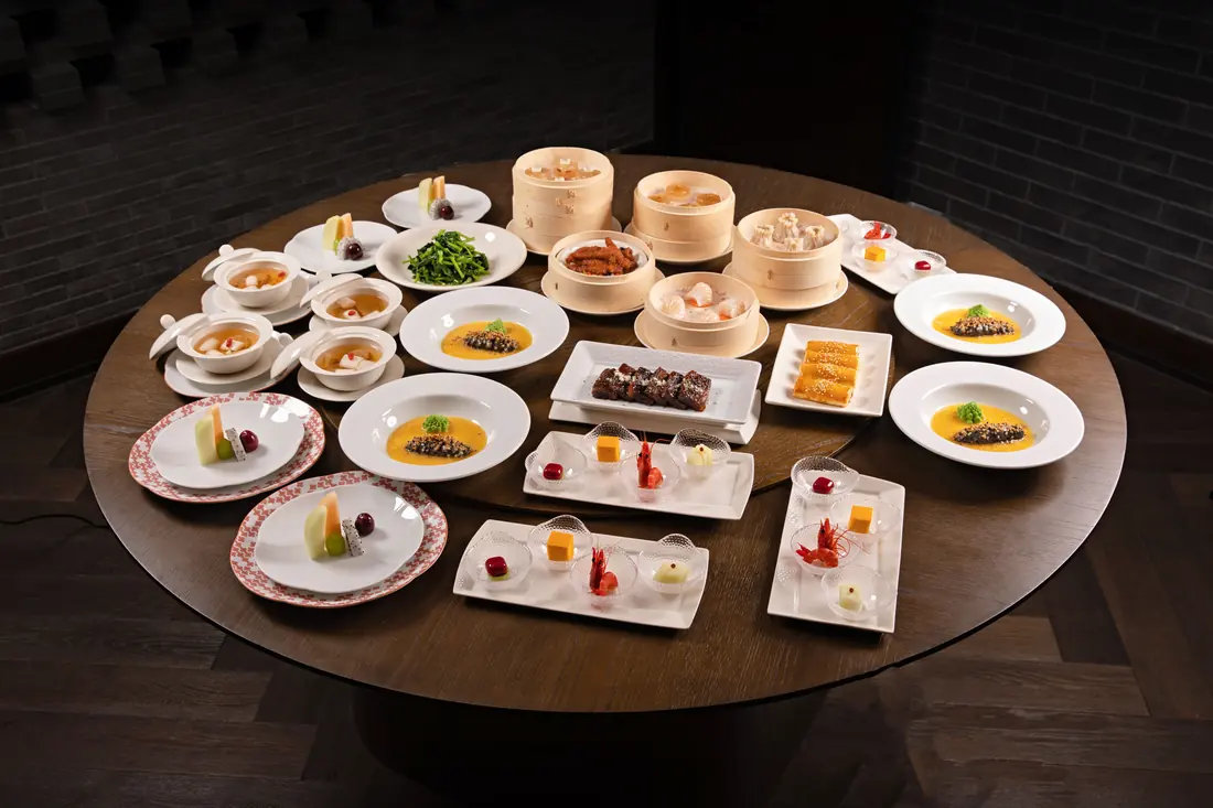 Small plates covering a round table