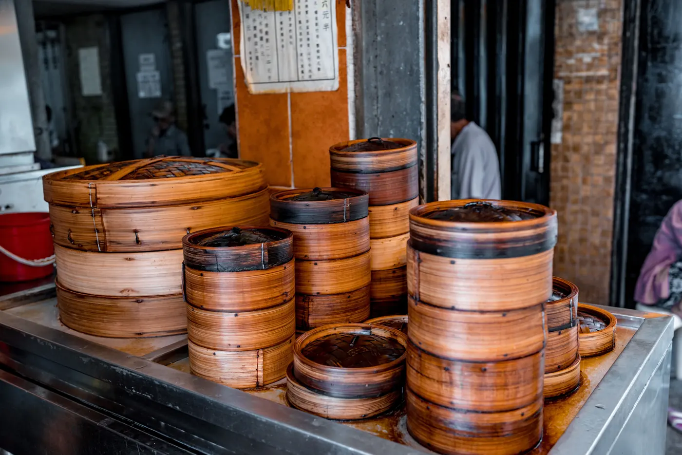 Bamboo steamers stacked at a stall