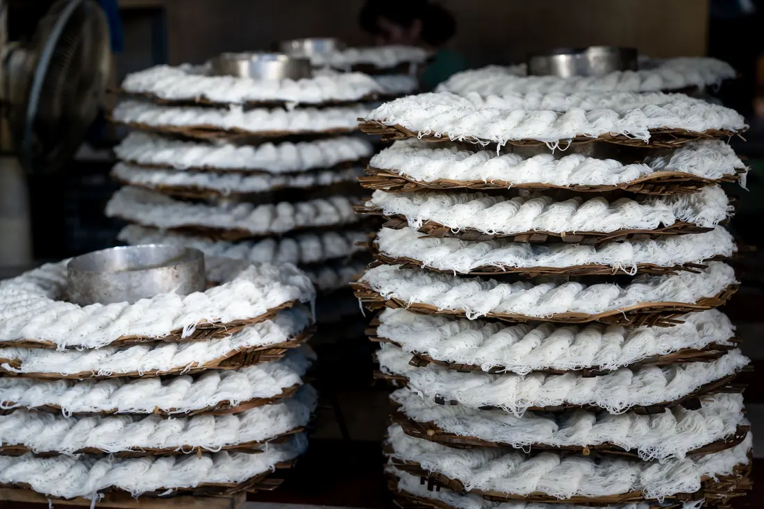 Dried rice paper sheets stacked in a pile