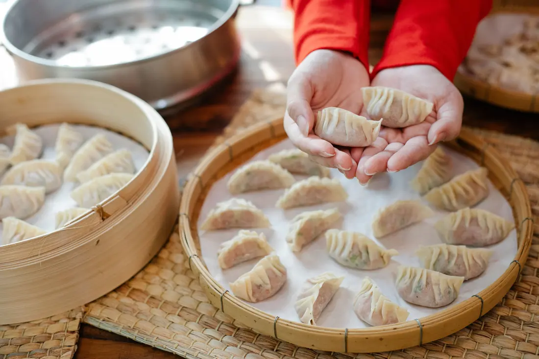 Steamed wontons in a bamboo basket