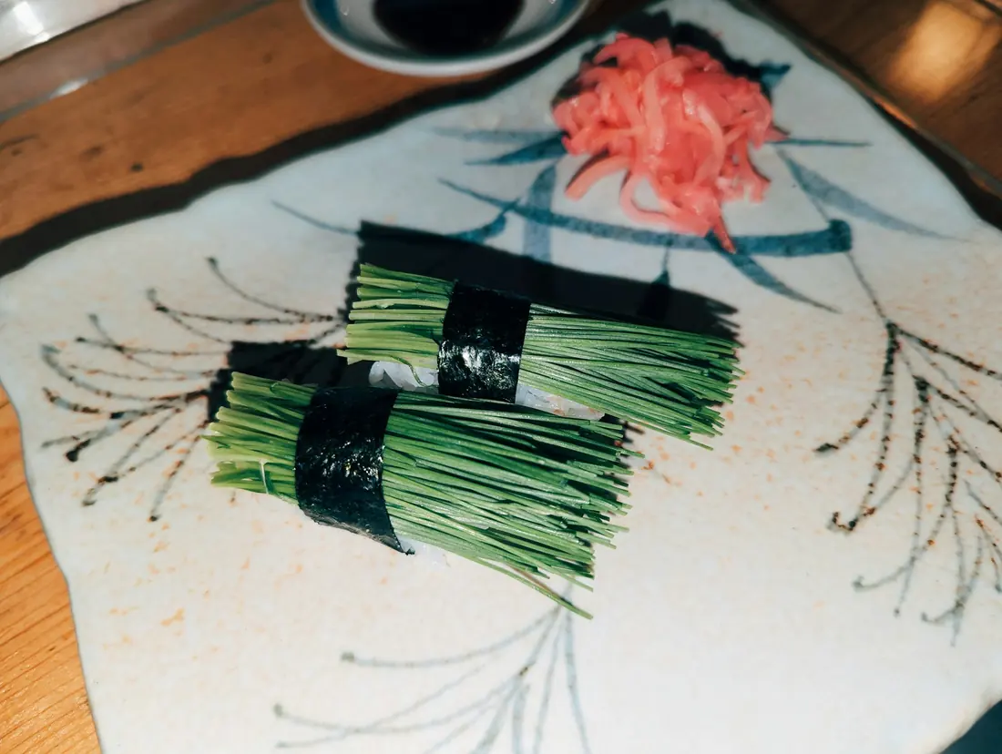 Roe and sliced scallion used as a sushi garnish