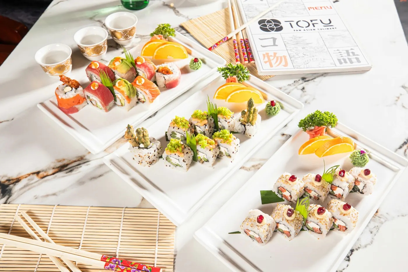 An assortment of sushi rolls arranged on a serving board