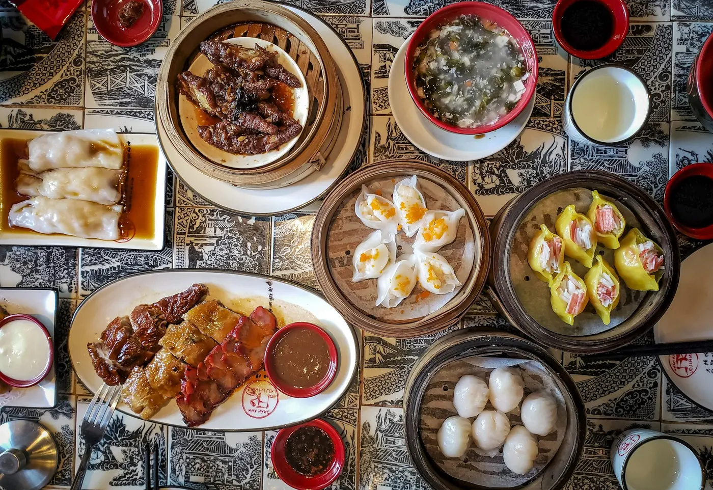 A table laid with several different Asian dishes to share