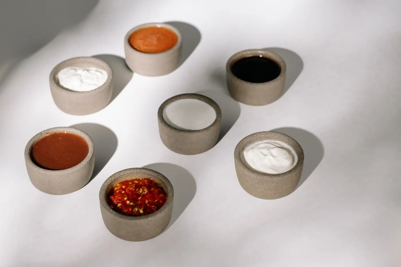 Small bowls of assorted sauces