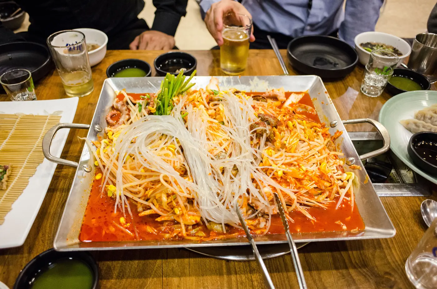A shared hot dish at a table
