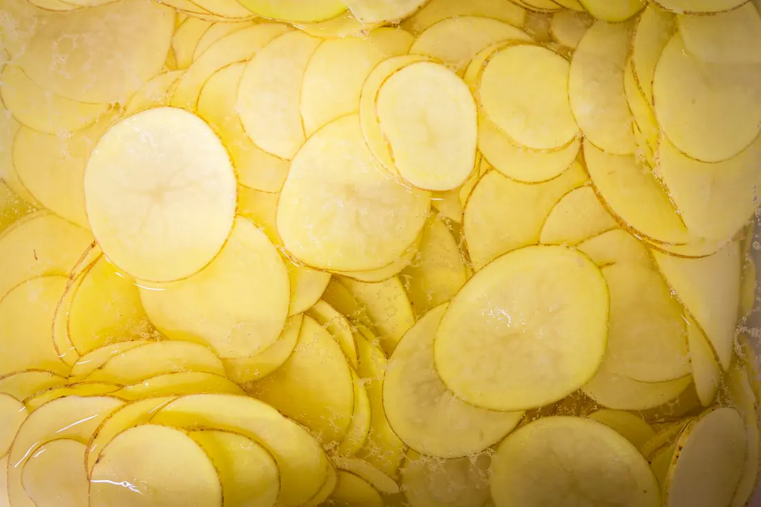 Pale yellow pickled radish slices